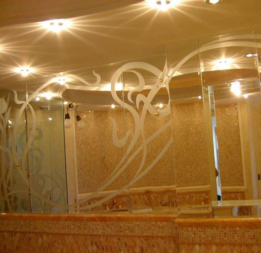 Etched design on washroom mirrors and shower