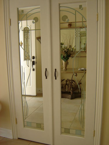 Modern design on back side of closet door mirrors