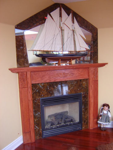 Marbleized glass fireplace covering and marbleized mirror above